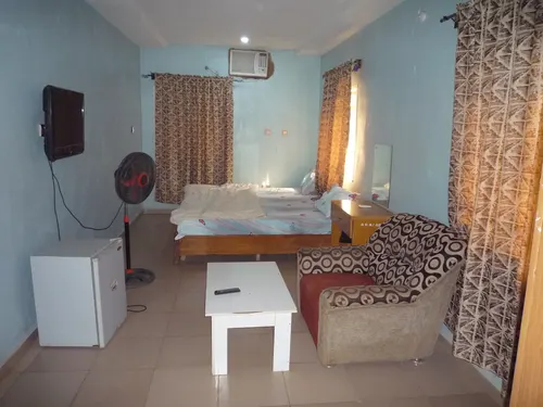 Amanda Garden Hotel Executive Room featuring sitting area with armchair and coffee table